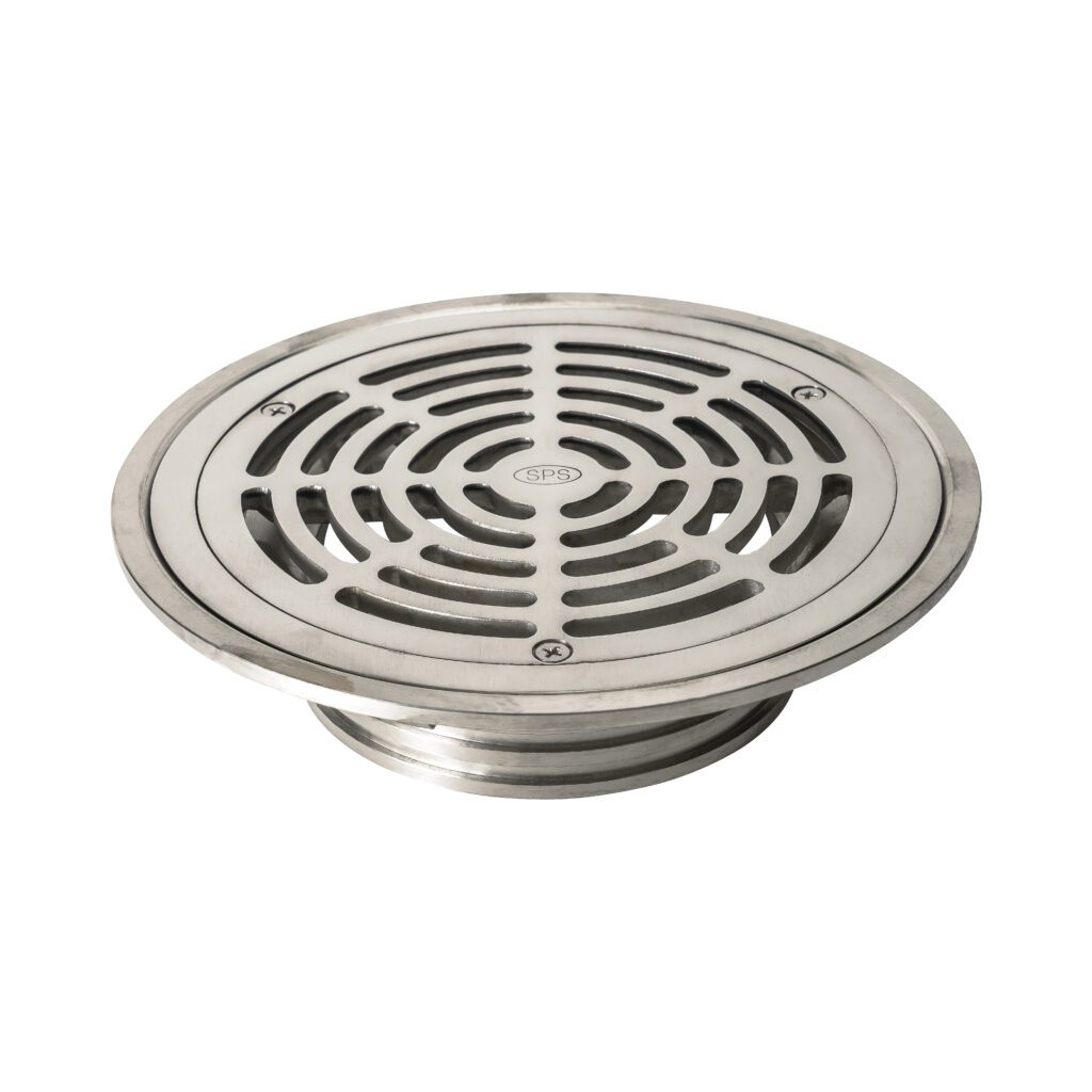 A round, stainless steel floor drain cover with a circular grid pattern and three screws securing it. The drain cover is photographed on a white background.